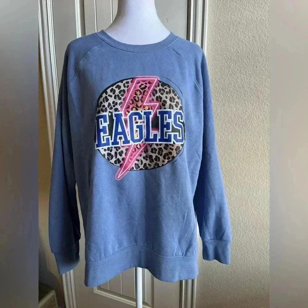 Graphic Sweatshirt for women says “Eagles”